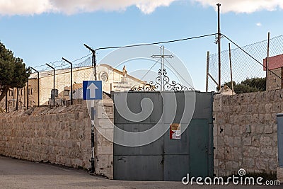 Stone statue of the Virgin Mary above the entrance to Eglise Syriaque Catholique Saint Joseph in Bethlehem in the Palestinian Editorial Stock Photo