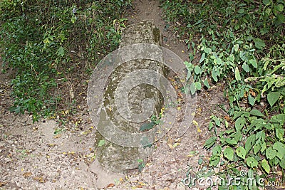 Stone stela near serpend mound Stock Photo