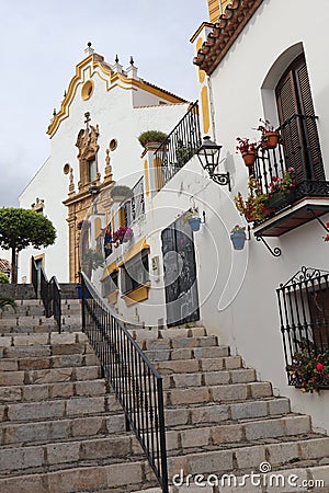 Stone steps lead upwards to the church Santa MarÃ­a de los Remedios in Estepona in Spain Stock Photo