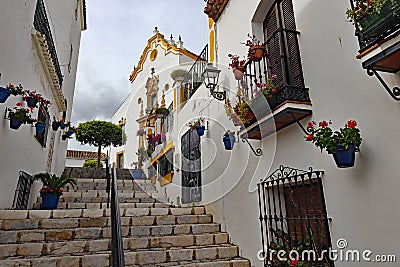 Stone steps lead upwards to the church Santa MarÃ­a de los Remedios in Estepona in Spain Stock Photo