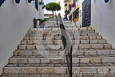 Stone steps lead upwards to the church Santa MarÃ­a de los Remedios in Estepona in Spain Stock Photo