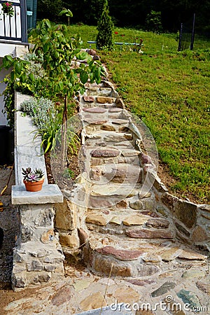 Stone steps made of river stones and rocks Stock Photo