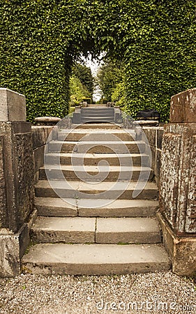 Stone Steps to arch and walk through Biddulph Grange Stock Photo