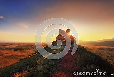 A stone during sunset on the top of a mountain in the Sunduki Park in Khakassia Stock Photo