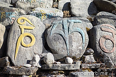 Stone with tibetian mantras Tibet sanscrit Stock Photo