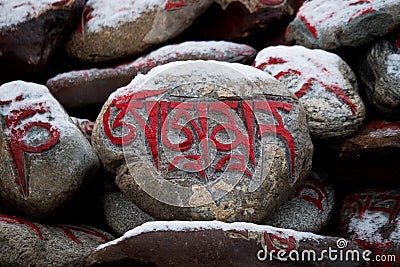 Stone with tibetian mantras Tibet sanscrit Editorial Stock Photo