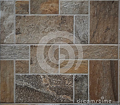 Stone tile rustic floor. The tiles are made of polished rocks of different types,colors and shapes . Stock Photo