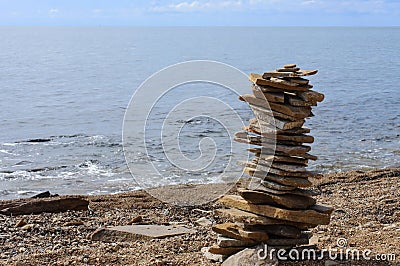 Stone tower on the seashore. Meditation Stock Photo