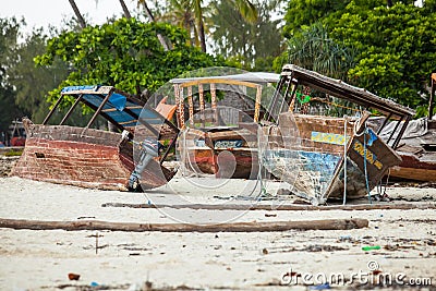 Boats resting on the beach awaiting repairs. Editorial Stock Photo