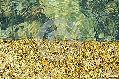 Golden trasparent water stones grass, decaying valleys, natural background Stock Photo