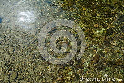 Stone under crystal clear water of Ganga River Stock Photo