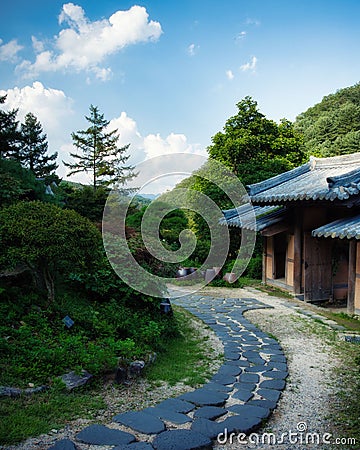 Stone walkway in front of a traditional Korean house in the Garden of Morning Calm Editorial Stock Photo