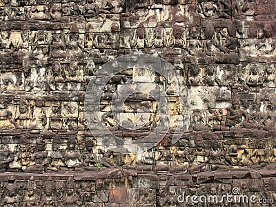 Stone wall with images of people carved on it temple complex Angkor Wat.. Stock Photo