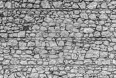 Stone wall of a medieval castle. Masonry. Stock Photo