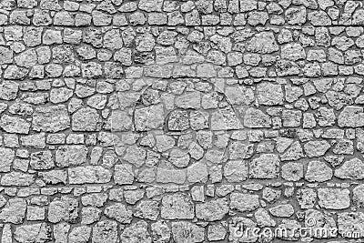 Stone wall of a medieval castle. Masonry. Stock Photo