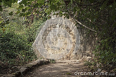 Stone Wall of an Old Hydroelectric Power Plant on the Hermon Stream in Israel Stock Photo