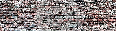 Stone wall panorama, panoramic stonewall pattern background, old aged weathered red and grey grunge limestone dolomite texture Stock Photo