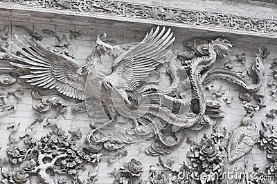 Stone wall Sculpture flying chinese swan flowers famous historical place Stock Photo