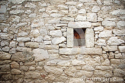 Stone wall with small window texture background Stock Photo