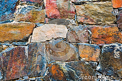 Stone wall texture background. Old rocks surface of a medieval fortress. Close-up natural pattern. Stock Photo
