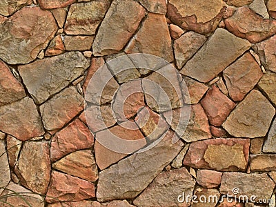 Stone wall textured background from stones with a reddish tint Stock Photo