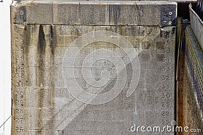 Stone wall in Titanic dry dock with waterlevel measurements. Belfast, UK. August 19, 2013. Editorial Stock Photo