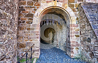 Stone wall with trap gate in Wernigerode Castle Stock Photo