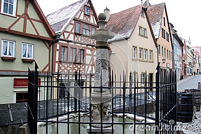 Stone water fountain at Ploenlein, Rothenburg ob der Tauber, Germany Editorial Stock Photo