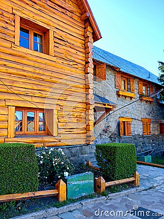 Stone and wood facade of mountain houses. Rustic high mountain constructions. Architecture in cold climates Stock Photo