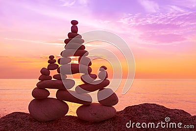 Stones balance on a background of sea sunset. Concept of harmony and balance Stock Photo