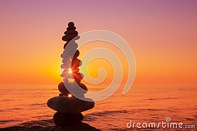 Stones balance on a background of sea sunset. Concept of harmony Stock Photo