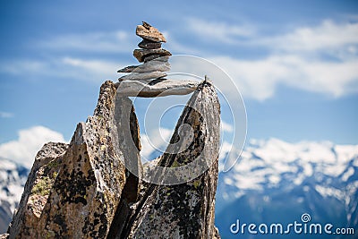 Stones cairn bridging gap near Eggishorn, Alps Stock Photo