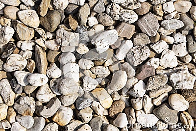 Stones on the ground. Rock background. Ground and stones. Rocky soil. Stone background. Natural Stock Photo