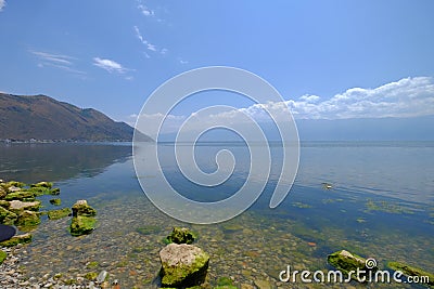 Stones & mountain by the lake in Dali-- Erhai Stock Photo