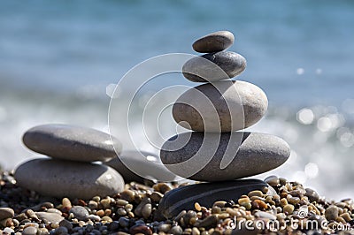 Stones and pebbles stack, harmony and balance, two stone cairns on seacoast Stock Photo