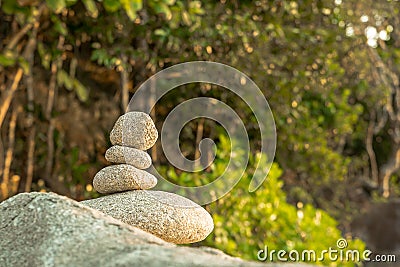 Stones pyramid on stone symbol of harmony and balance. Stock Photo