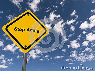 stop aging traffic sign on blue sky Stock Photo