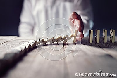 Stop the domino effect concept for business solution and intervention Stock Photo