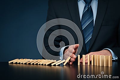 Stop domino effect and risk management Stock Photo