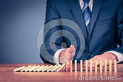 Stop domino effect and risk management Stock Photo