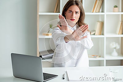 stop gesture protesting woman unpleasant work Stock Photo