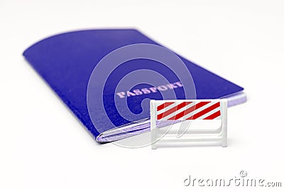 Stop illegal migration concept, blue passport with a road barrier on white background Stock Photo