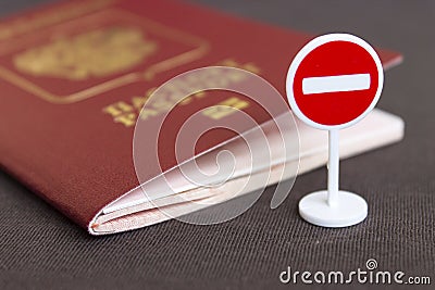 Stop illegal migration concept, Russian passport and stop sign close up. Stock Photo