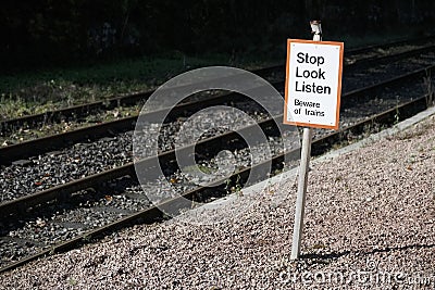 Stop look listen safety road sign at railway train station danger warning sign Stock Photo
