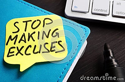 Stop making excuses written on a piece of paper Stock Photo