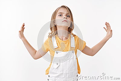 Stop it, not like. Serious-looking arrogant and moody little kid, blond girl restrain from everything raise nose and Stock Photo