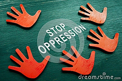 Stop oppression concept. Red hands and phrase. Stock Photo