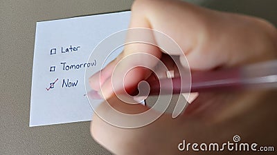 Stop procrastinate concept. Checklist whether to do a task later, tomorrow or now Stock Photo