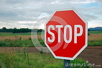 Stop Sign on Country Road Stock Photo