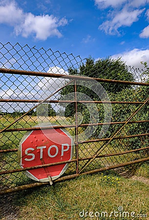 Road Stop Sign seen fitted to a farm gate entrance. Editorial Stock Photo